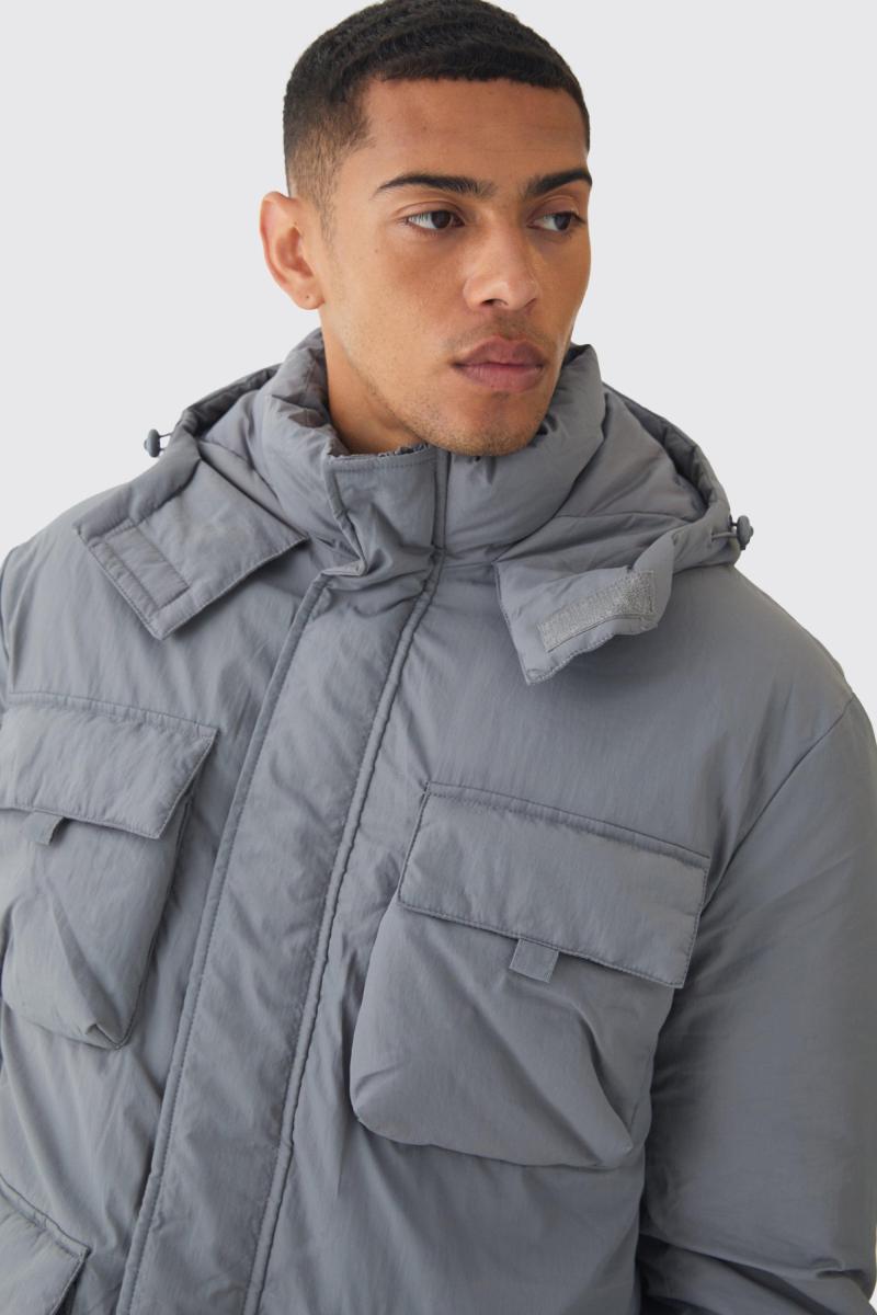 Сіра парка з кишеньковим капюшоном