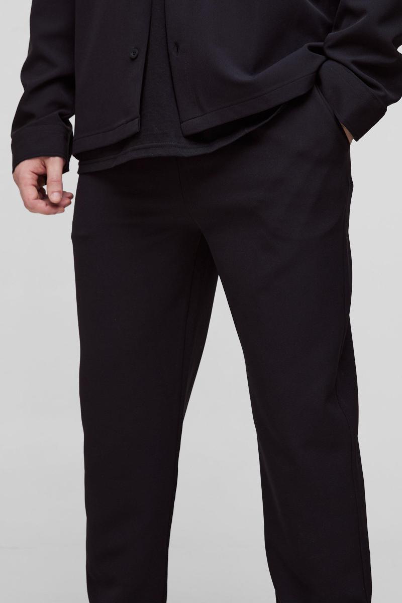 Високі стрейч-ткані звужені штани